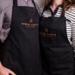 couple in matching aprons